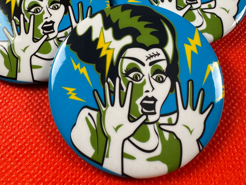 Round pin-back button portraying retro illustration of Frankenstein's Bride