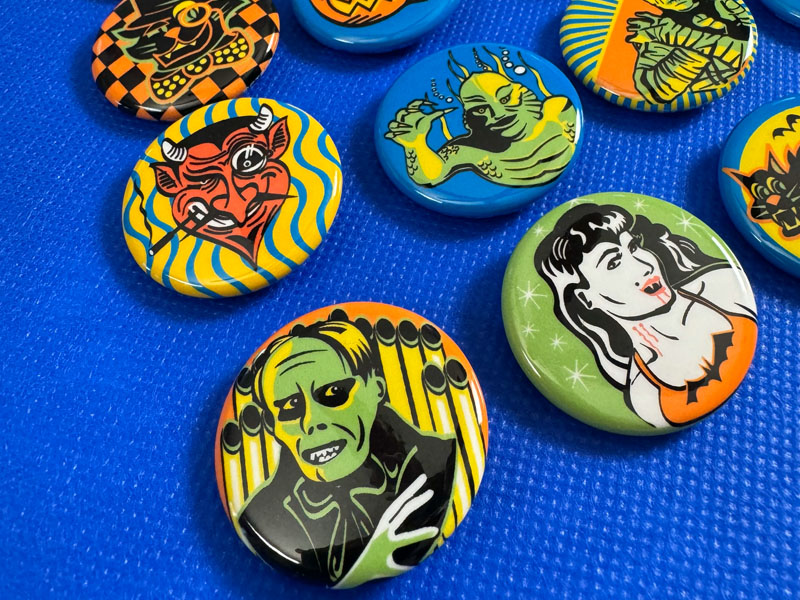 Phantom of the Opera pin and other assorted retro Halloween pins.